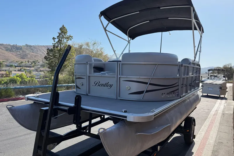 Slide: The Image of 2018 Bentley Pontoons 180 CRUISE on trailer, scenic background, sunny day. - 3