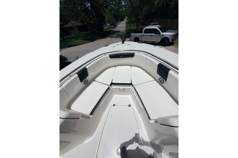 Slide: The Image of 2022 Robalo R302 Center Console boat with spacious seating area. - 15