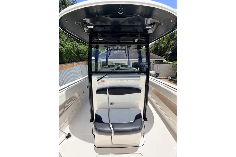 Slide: The Image of 2022 Robalo R302 Center Console boat interior with seating and console view. - 21