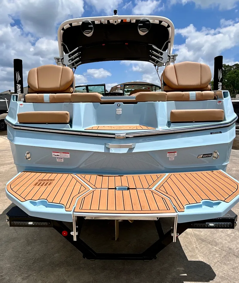 Slide: The Image of Rear view of 2026 MasterCraft XT23 boat with teak platform. - 11