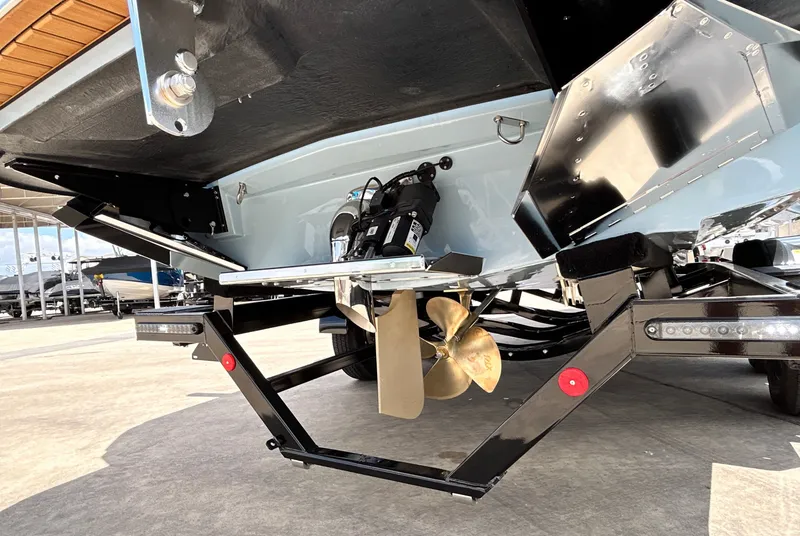 Slide: The Image of Rear view of 2026 MasterCraft XT23 boat with propeller and trailer. - 15