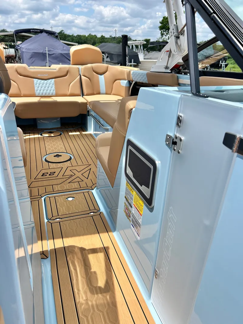 Slide: The Image of Interior of a 2026 MasterCraft XT23 boat with luxurious features. - 25