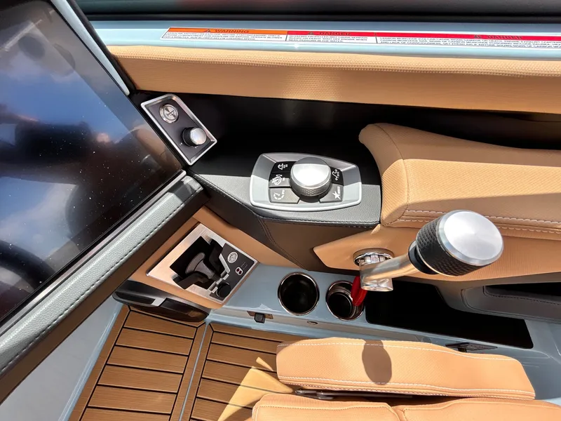 Slide: The Image of Interior of 2026 MasterCraft XT23 with control console and controls. - 30