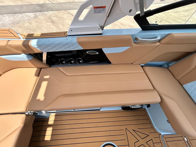 Slide: The Image of Interior of 2026 MasterCraft XT23 with luxurious leather seating. - 37