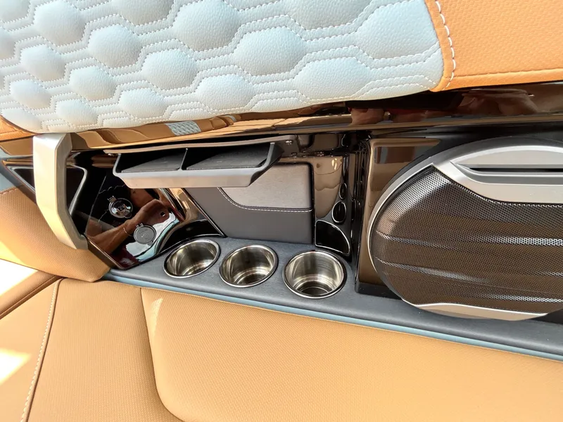 Slide: The Image of Interior of 2026 MasterCraft XT23 with speaker and cup holders. - 38