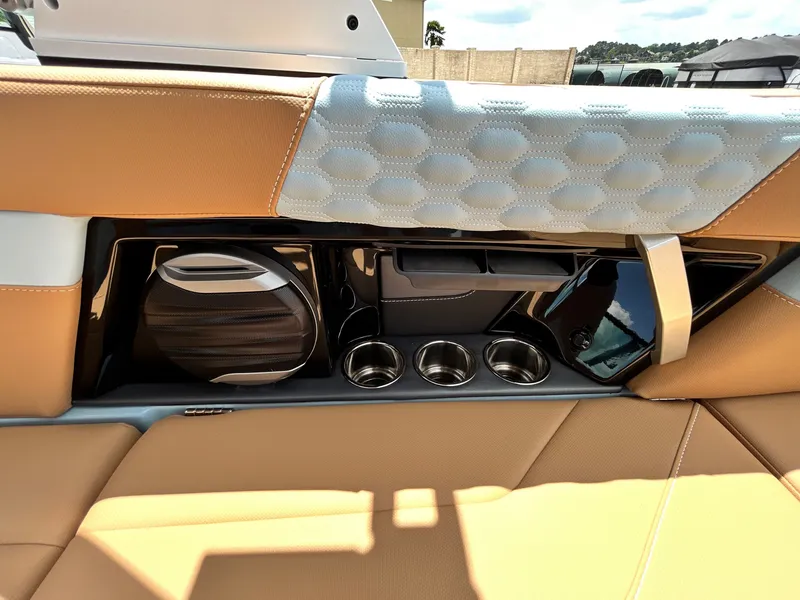 Slide: The Image of Interior of 2026 MasterCraft XT23 with speaker and cup holders. - 44