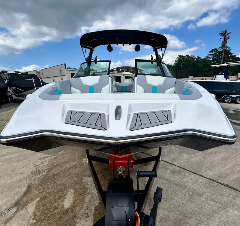 Slide: The Image of 2026 MasterCraft XT22 boat on trailer, front view. - 10