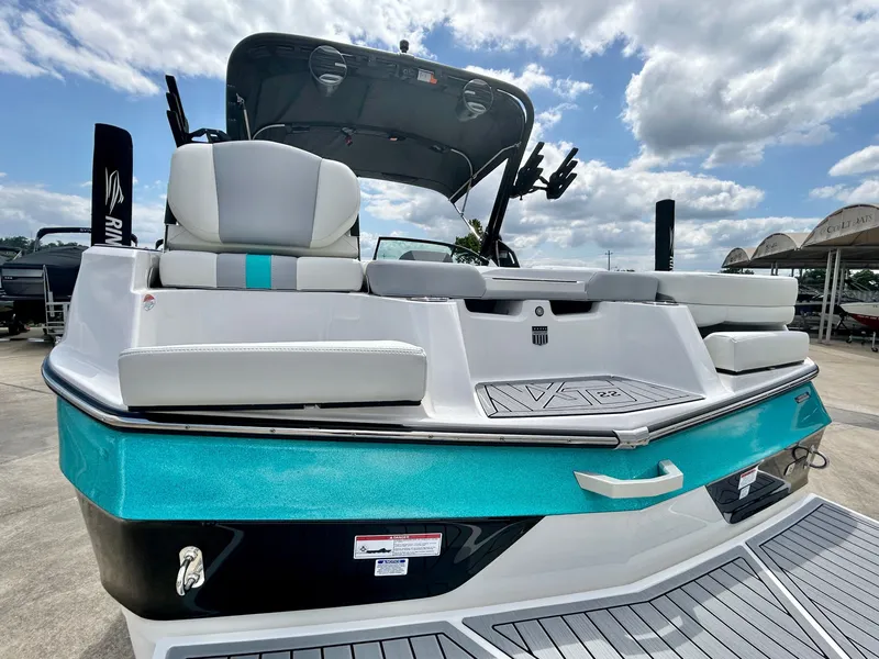 Slide: The Image of 2026 MasterCraft XT22 boat with stylish design and comfortable seating area. - 12