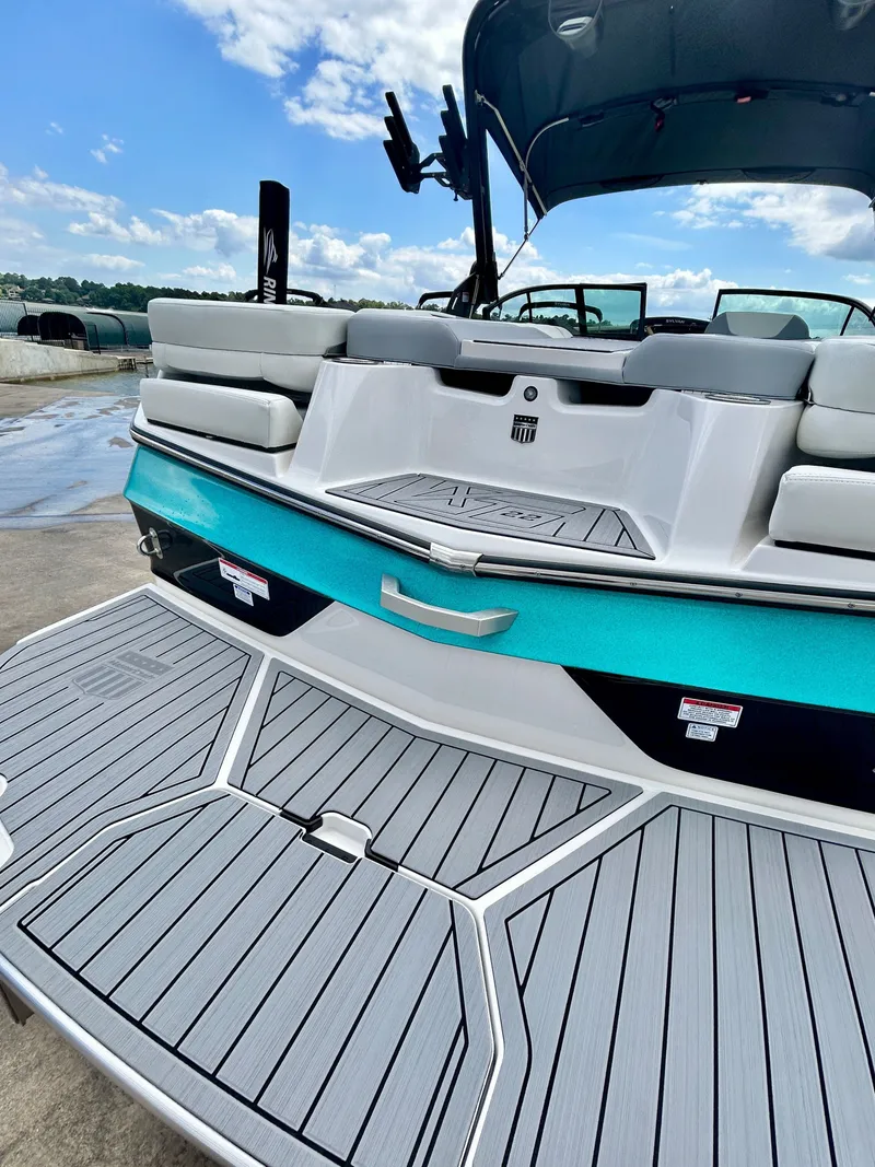 Slide: The Image of Rear view of 2026 MasterCraft XT22 boat with gray deck. - 13
