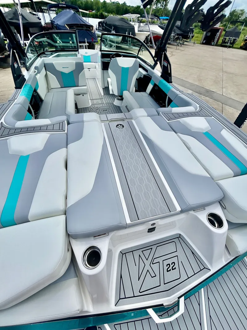Slide: The Image of Interior of 2026 MasterCraft XT22 with gray and blue seating. - 17