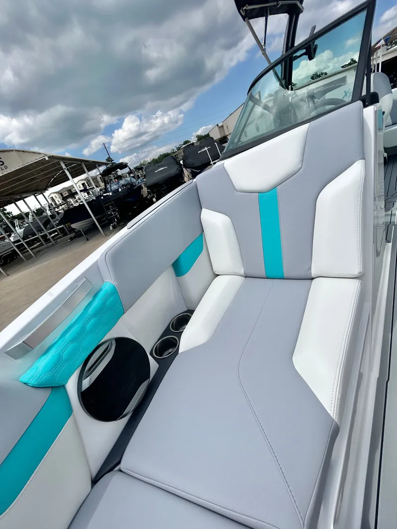 Slide: The Image of Interior of 2026 MasterCraft XT22 with gray and blue seating. - 20