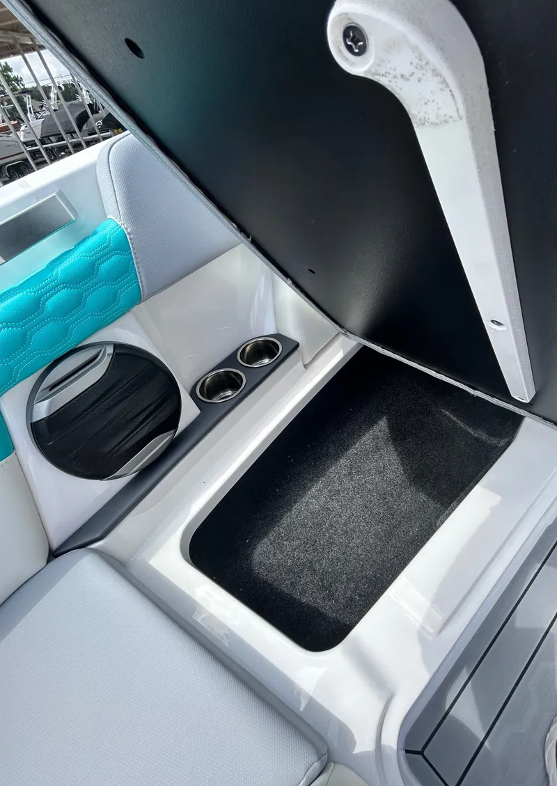 Slide: The Image of Interior of 2026 MasterCraft XT22 with storage and cup holders. - 21