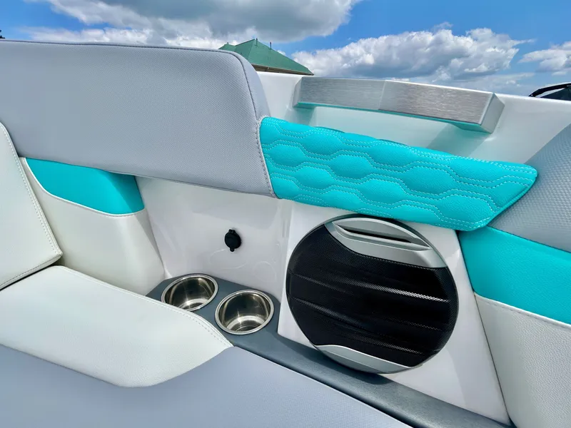 Slide: The Image of 2026 MasterCraft XT22 interior with turquoise accents and speaker. - 23