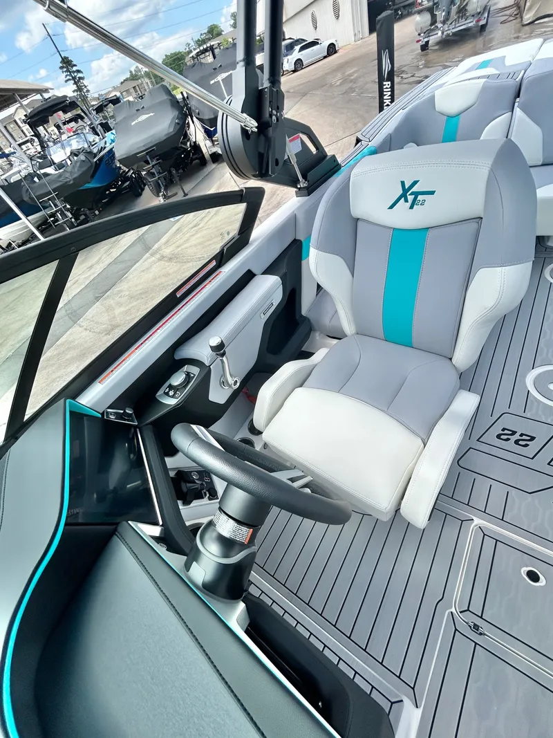 Slide: The Image of Interior of 2026 MasterCraft XT22 with modern helm station. - 26