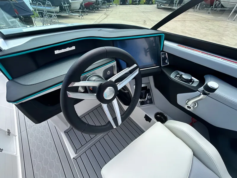 Slide: The Image of Interior of 2026 MasterCraft XT22 with modern steering wheel and dashboard. - 30