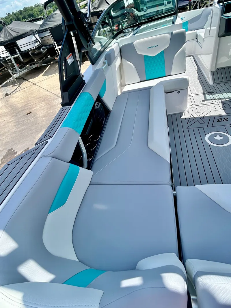 Slide: The Image of Interior of 2026 MasterCraft XT22 with gray and turquoise seating. - 36