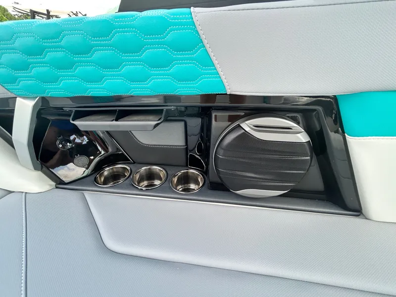 Slide: The Image of Interior of 2026 MasterCraft XT22 with speaker and cup holders. - 39