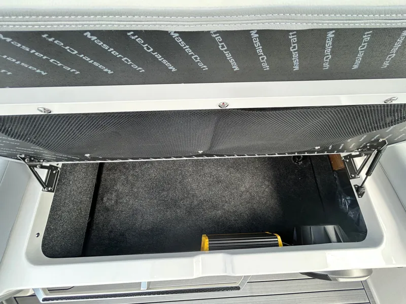 Slide: The Image of Storage compartment in MasterCraft XT22 boat, model year 2026. - 40