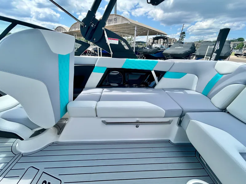 Slide: The Image of Interior of 2026 MasterCraft XT22 with modern seating and blue accents. - 44