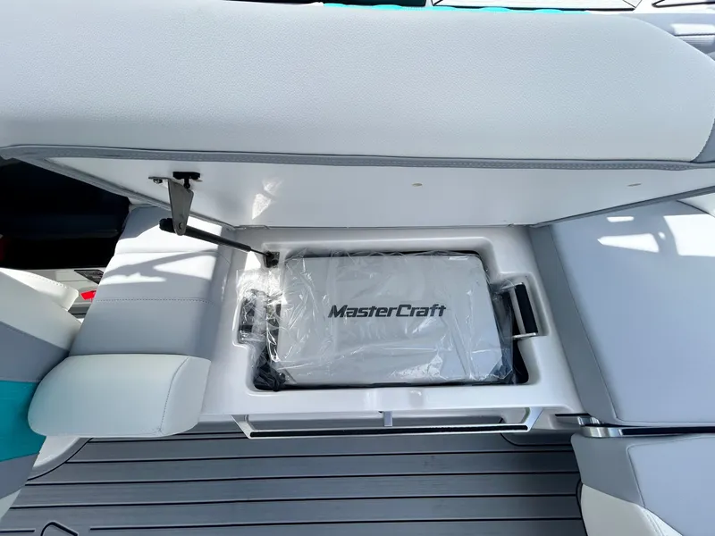 Slide: The Image of MasterCraft XT22 2026 seat with storage compartment. - 46