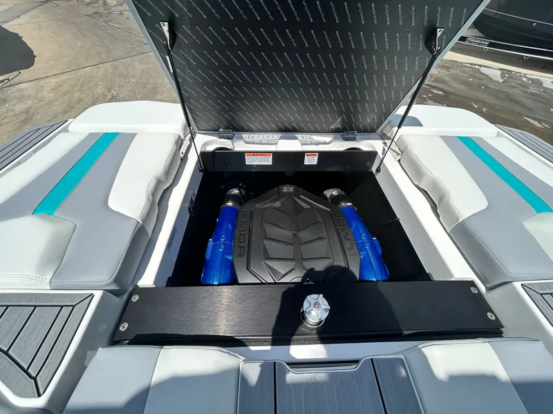 Slide: The Image of Engine compartment of 2026 MasterCraft XT22 with open lid. - 48