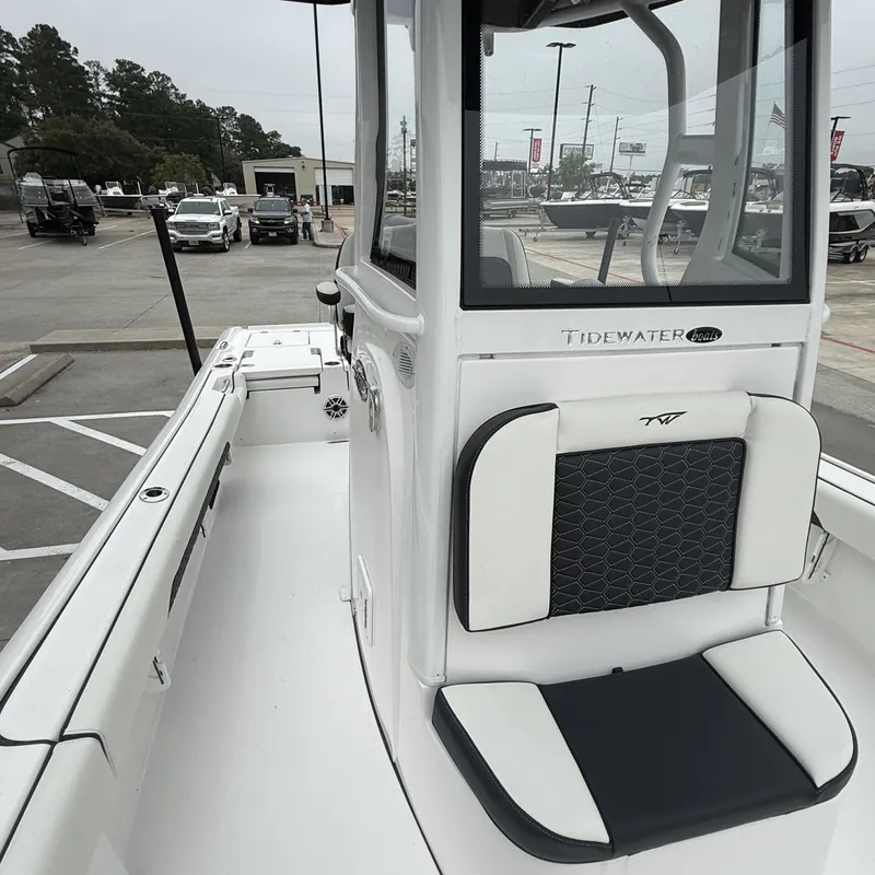 Slide: The Image of 2026 Tidewater 2500 Carolina Bay boat displayed outdoors. - 24
