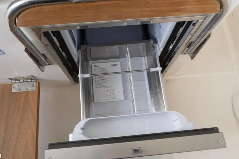 Slide: The Image of Open drawer on 2026 Tiara Yachts 34 LS, showcasing interior storage space. - 10