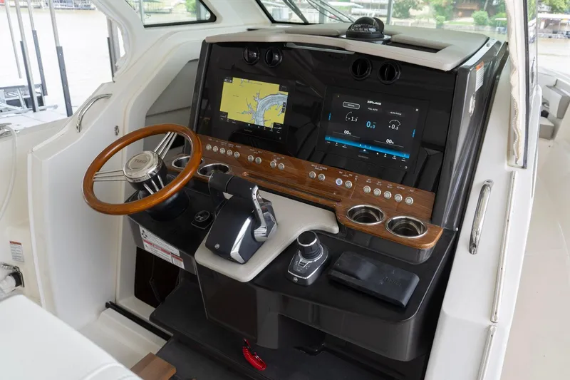 Slide: The Image of Helm of 2026 Tiara Yachts 34 LS featuring advanced navigation displays and controls. - 11