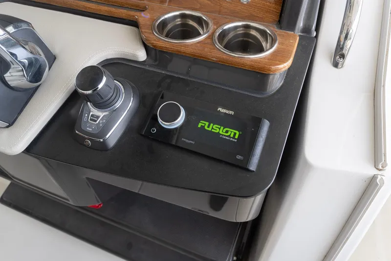 Slide: The Image of Control panel of 2026 Tiara Yachts 34 LS with joystick and Fusion audio system. - 12