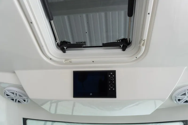 Slide: The Image of 2026 Tiara Yachts 34 LS interior with hatch and control panel. - 13