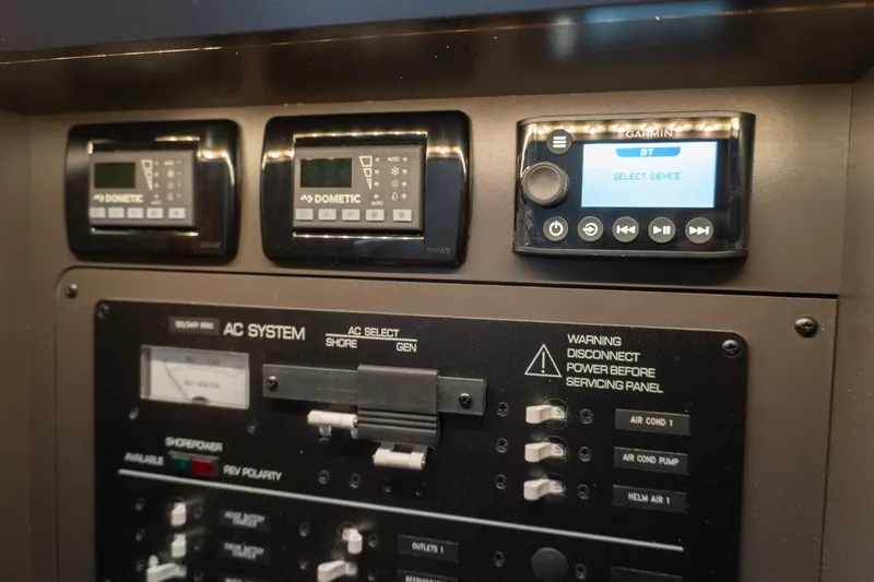 Slide: The Image of Control panel of 2026 Tiara Yachts 34 LS featuring Dometic and Garmin systems. - 16