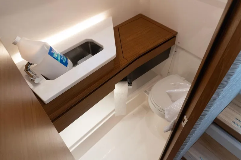 Slide: The Image of 2026 Tiara Yachts 34 LS bathroom with modern sink and toilet design. - 17
