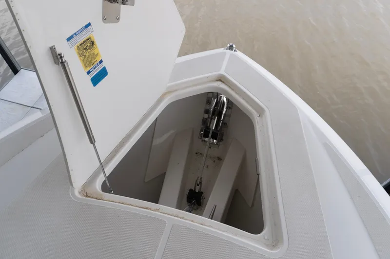Slide: The Image of Open anchor locker on 2026 Tiara Yachts 34 LS, showcasing storage compartment. - 19