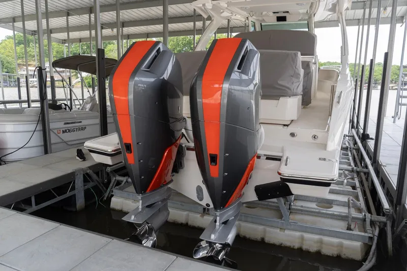 Slide: The Image of 2026 Tiara Yachts 34 LS with dual outboard engines docked in a marina. - 3