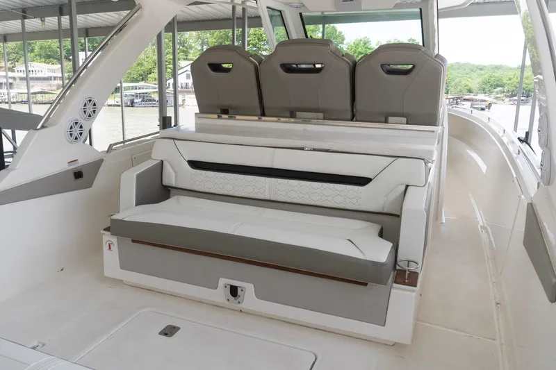 Slide: The Image of 2026 Tiara Yachts 34 LS interior seating area with modern design and comfortable upholstery. - 5