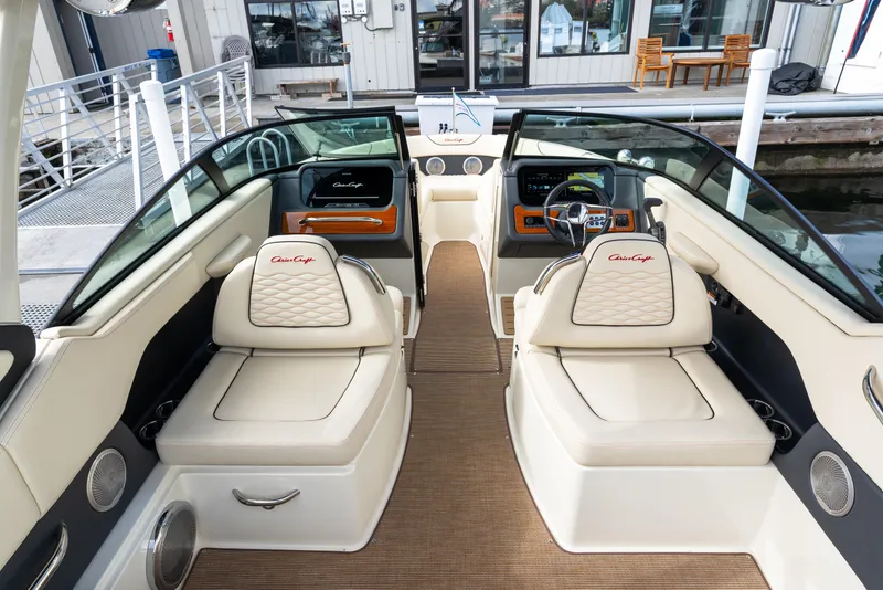 Slide: The Image of 2025 Chris-Craft Sportster 25 boat interior with luxurious seating and modern dashboard. - 16