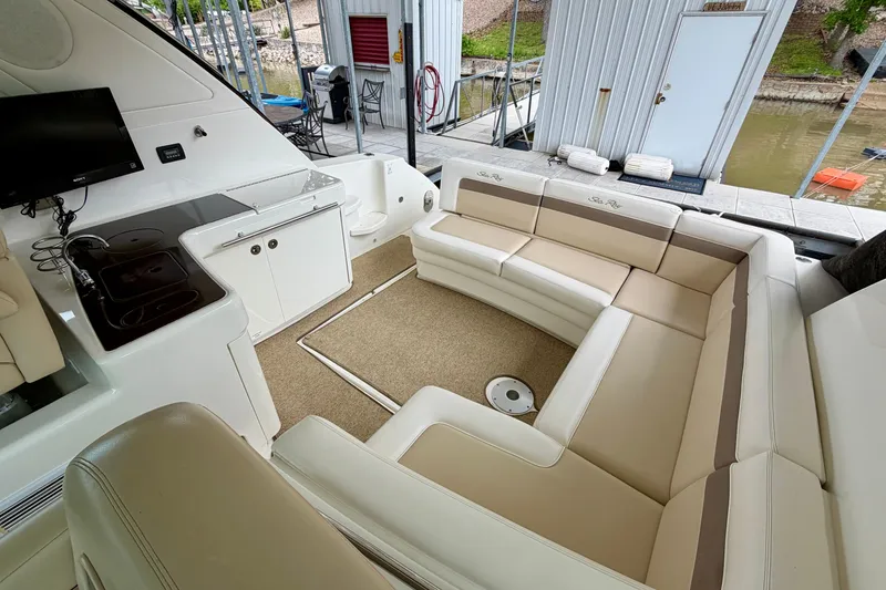 Slide: The Image of Luxurious interior of 2012 Sea Ray 450 Sundancer yacht with spacious seating and kitchenette. - 12