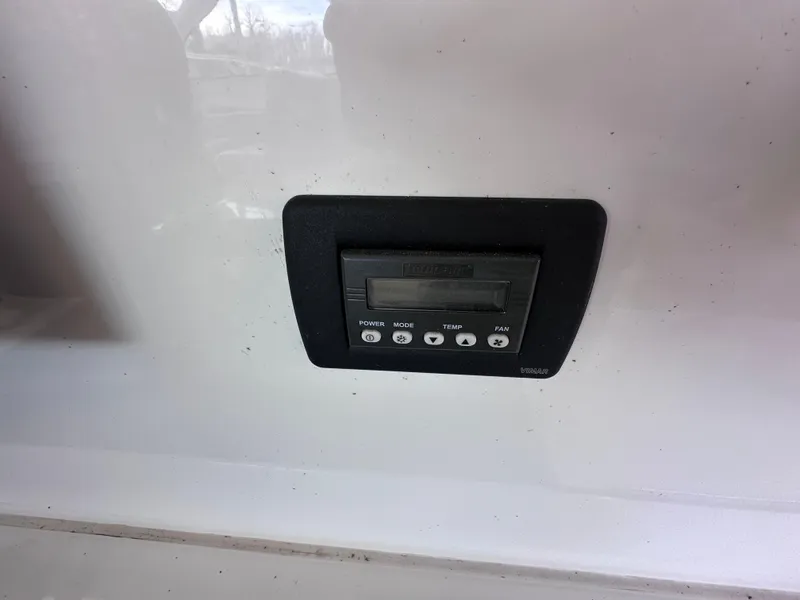 Slide: The Image of Control panel on a 2012 Sea Ray 450 Sundancer boat dashboard. - 16