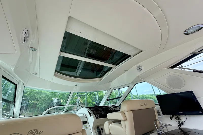 Slide: The Image of Interior view of 2012 Sea Ray 450 Sundancer yacht with sunroof and helm station. - 20
