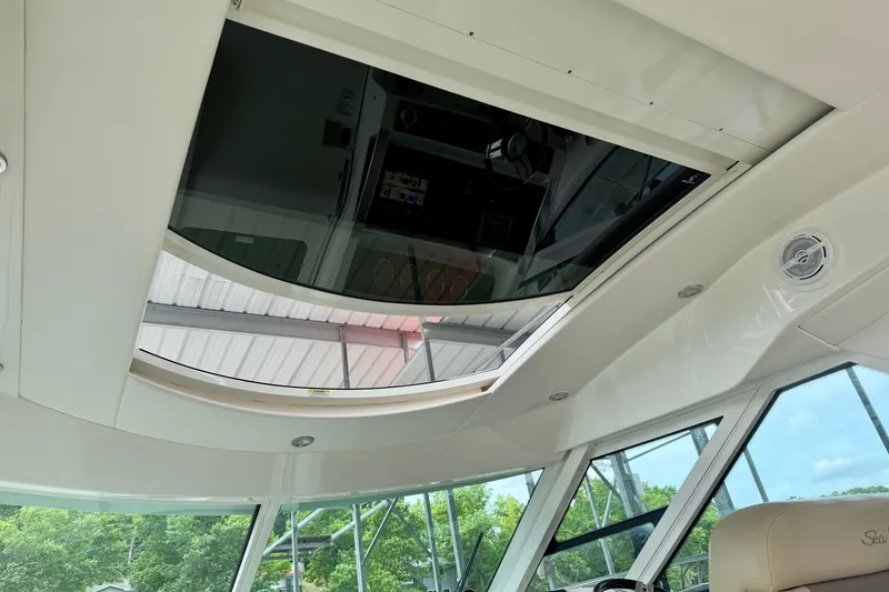 Slide: The Image of Interior view of 2012 Sea Ray 450 Sundancer yacht with sunroof and sleek design. - 22