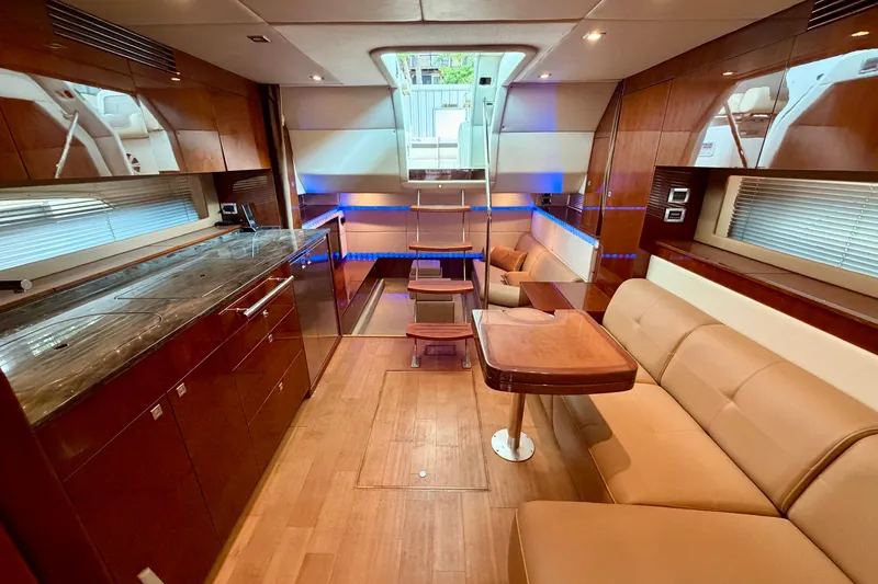 Slide: The Image of Luxurious interior of a 2012 Sea Ray 450 Sundancer yacht with elegant wood finishes. - 32