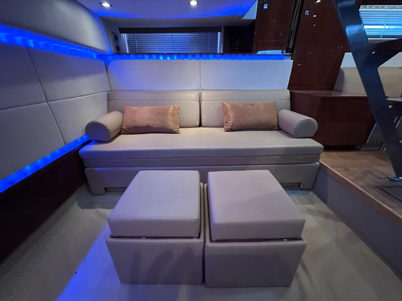 Slide: The Image of Luxurious interior of 2012 Sea Ray 450 Sundancer with modern seating and ambient lighting. - 36