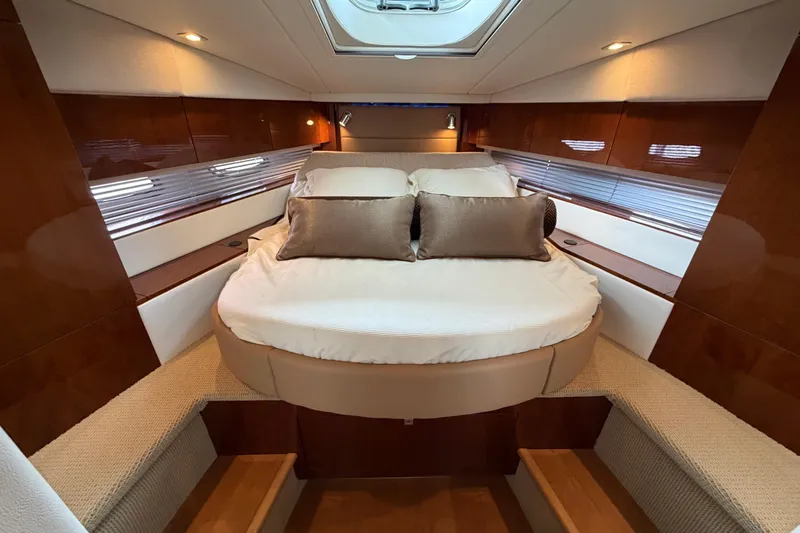 Slide: The Image of Luxurious cabin interior of 2012 Sea Ray 450 Sundancer yacht with elegant bedding. - 37