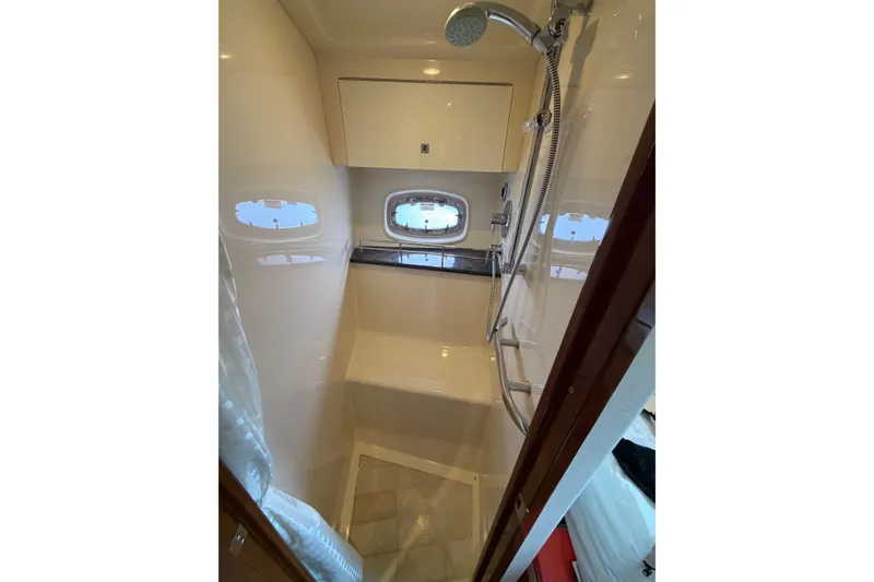 Slide: The Image of Luxurious bathroom in 2012 Sea Ray 450 Sundancer yacht with shower and window. - 42