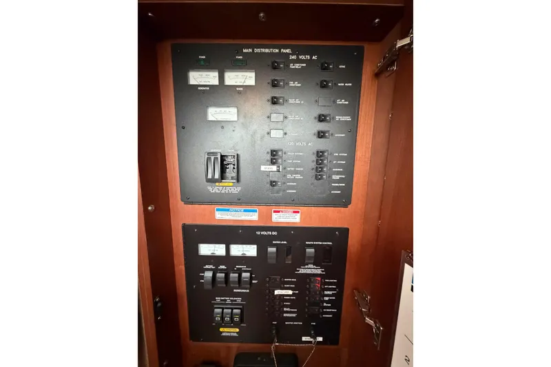 Slide: The Image of Electrical control panel on a 2012 Sea Ray 450 Sundancer boat. - 43