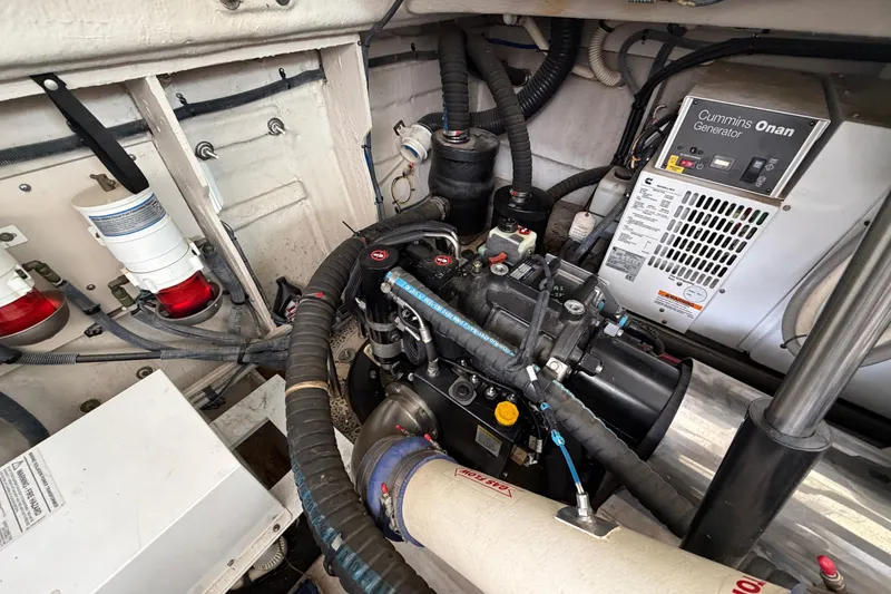 Slide: The Image of Engine room of 2012 Sea Ray 450 Sundancer with Cummins Onan generator and various components. - 50