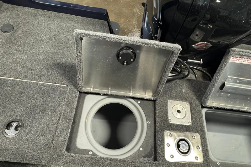 Slide: The Image of 2026 Tracker Pro Guide V-175 WT boat interior with storage compartments and motor. - 10