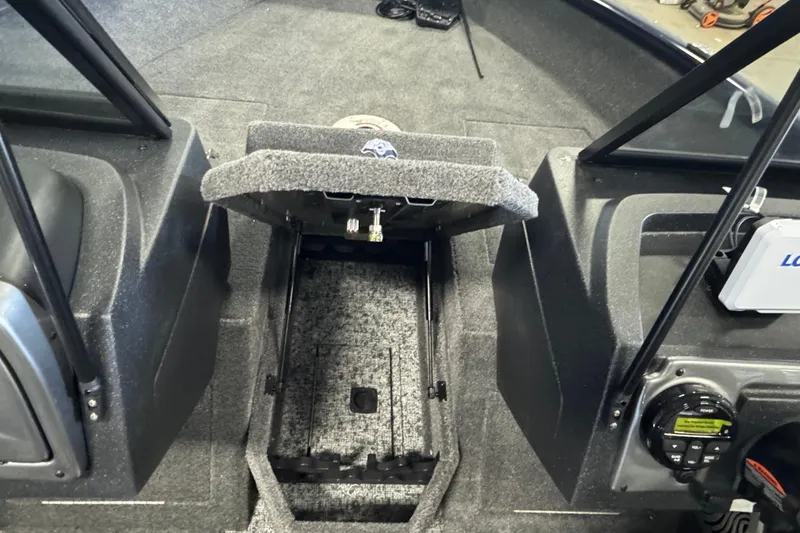 Slide: The Image of 2026 Tracker Pro Guide V-175 WT boat interior with open storage compartment. - 11