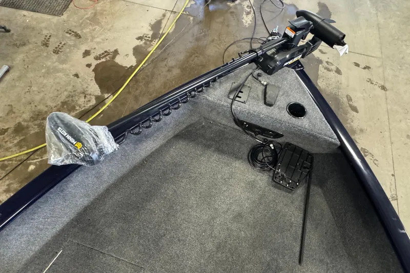 Slide: The Image of 2026 Tracker Pro Guide V-175 WT boat interior with Minn Kota trolling motor. - 12