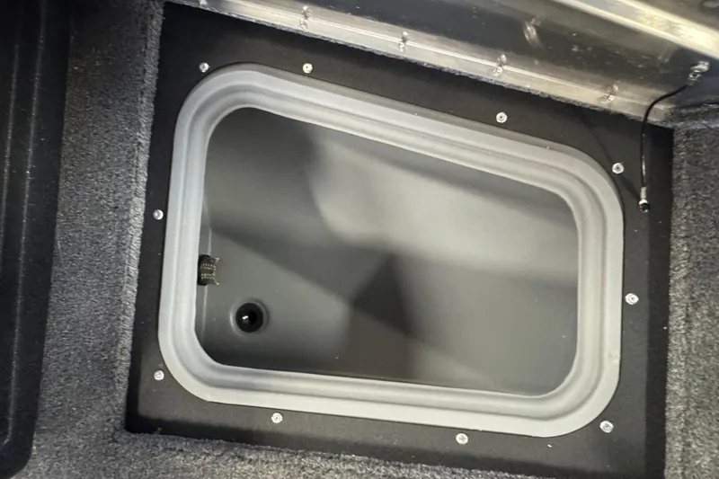 Slide: The Image of Storage compartment in 2026 Tracker Pro Guide V-175 WT boat, featuring secure lid and durable design. - 14